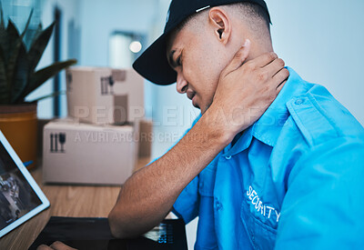 Buy stock photo Burnout, desk and a security man with neck pain, health or stress from work in safety. Frustrated, tired and a bodyguard or worker with a muscle injury, inflammation or feeling after an accident