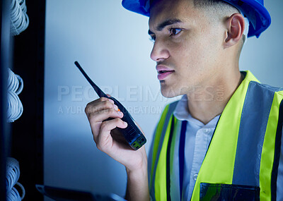 Buy stock photo Man, engineering and radio in server room for communication, power update and inspection. Young technician, electrician or contractor check cables, security system or electricity with walkie talkie