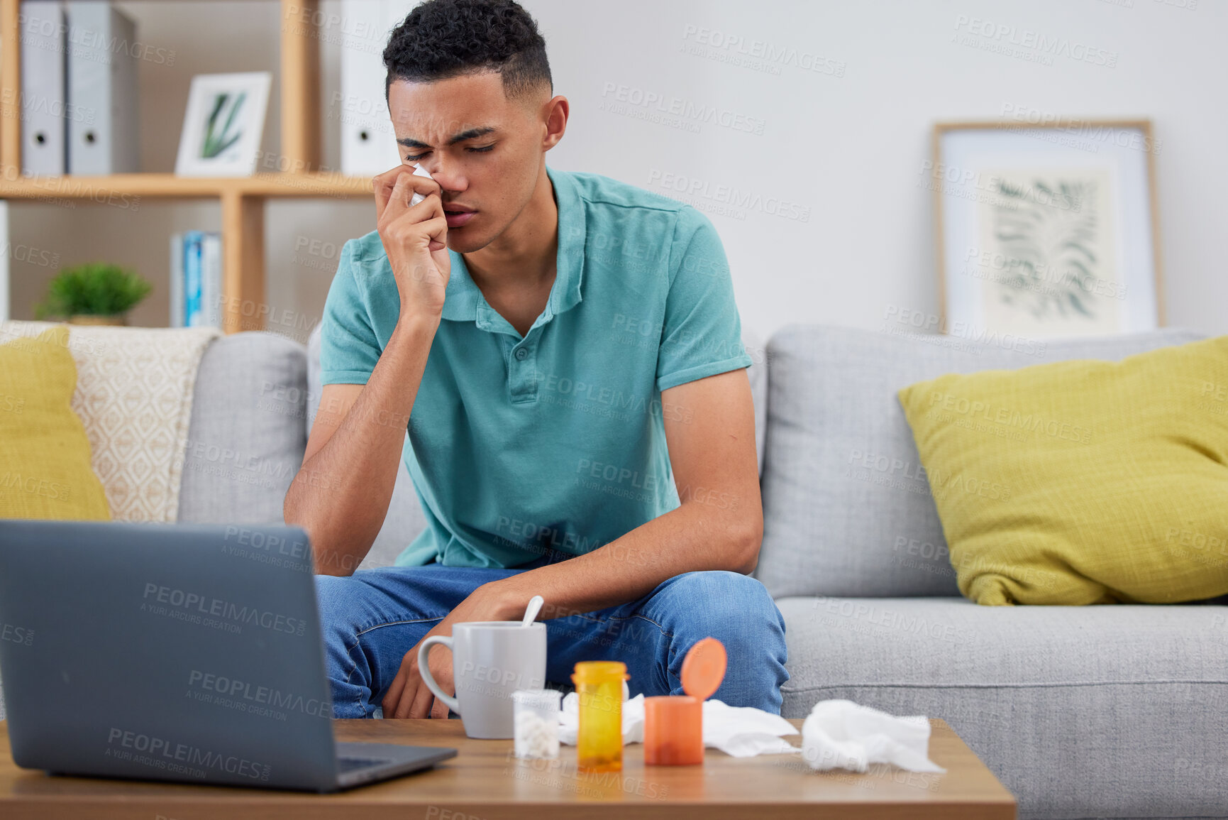 Buy stock photo Young man, sofa and sick with virus, laptop and streaming online or research about symptoms, medicine and health. Male person, healthcare and browse on pc with pills, pharmaceutical and drugs for flu