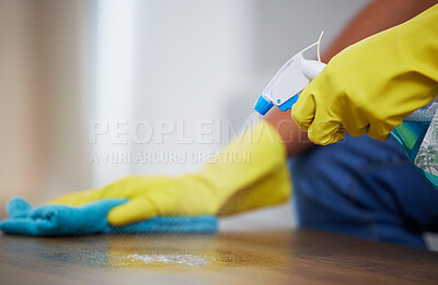 Buy stock photo Cleaning spray, wipe and hands of a person on a table for dust, housekeeping service and morning routine. Dirt, hygiene and cleaner with liquid detergent for a sanitary counter for a fresh home