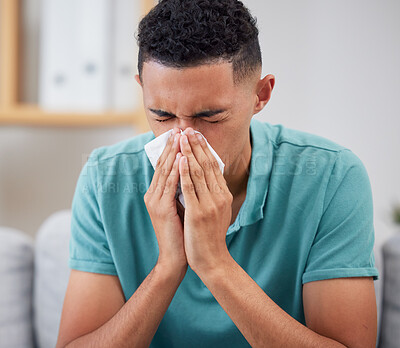 Man blowing nose, sick with virus and health with covid, medicine with cold or flu while at home. Young male person, allergy and sinus, healthcare and wellness, infection and illness with bacteria