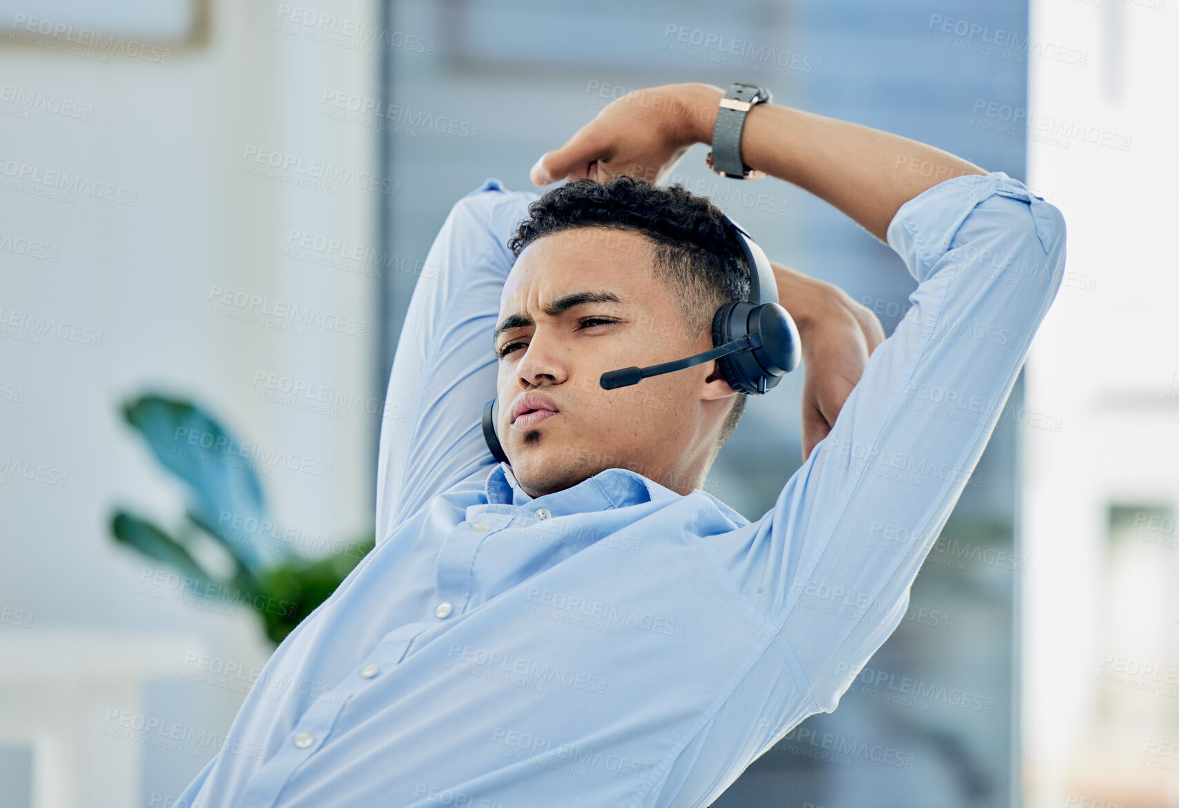 Buy stock photo Tired, stretching and man in call center with stress for telemarketing, customer service and sales consulting. Lazy, uncomfortable and male agent on a break for burnout, fatigue or bored at help desk