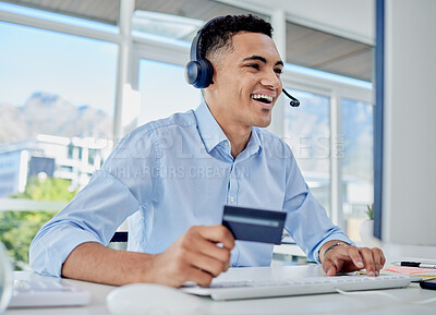 Buy stock photo Credit card, online shopping and call center man in the office for sale, promotion or discount. Ecommerce, technology and male telemarketing agent paying bills, mortgage or debt online in workplace.