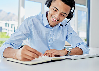 Buy stock photo Smile, call center and a man with a notebook for planning, telemarketing agenda or consulting notes. Happy, office and a customer service employee writing a strategy for online support or advice