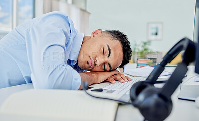 Buy stock photo Call center, tired and man sleeping on desk in a workplace, employee and insomnia with mental health. Business, fatigue and consultant with burnout, tech and exhausted with nap at work with stress