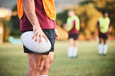 Buy stock photo Rugby, man and closeup with ball for sports games, competition and contest on field. Hands of athlete, person and outdoor training at stadium for fitness, exercise and performance challenge on pitch 