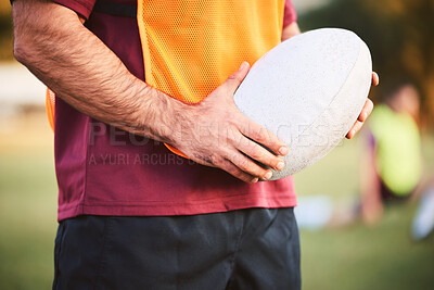 Buy stock photo Rugby, man and hands with ball for outdoor games, competition and contest on field. Closeup of athlete, sports player and match at stadium for fitness, exercise and performance challenge on pitch 