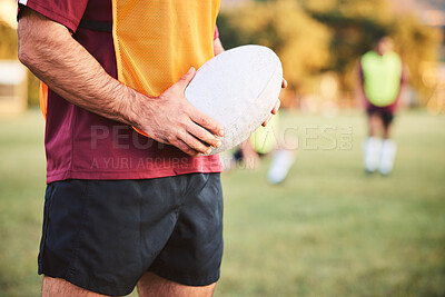 Buy stock photo Rugby, man and hands with ball for sports games, competition and contest on field. Closeup of athlete, team player and training at stadium for fitness, exercise and performance of challenge outdoor 