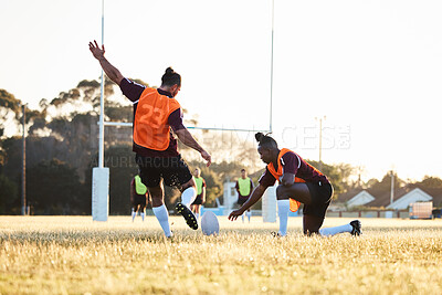 Buy stock photo Rugby, kick and sport game with support, exercise and competition with athlete ball training. Field, back and target practice on grass with cardio, fitness and team workout outdoor for teamwork