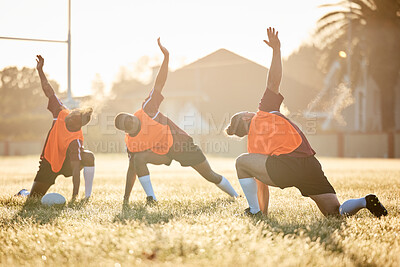 Buy stock photo Rugby, club and team stretching at training for match or competition in the morning doing warm up exercise on grass. Wellness, teamwork and group of players workout together in professional sports