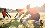 Rugby, team and people stretching at training for match or competition in the morning doing warm up exercise on grass. Wellness, teamwork and group of players workout together in professional sports