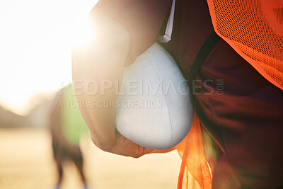 Buy stock photo Rugby, sports and hands on ball in exercise, workout or training outdoor at field lens flare. American football, fitness and man ready to start practice in game, competition or match for body health