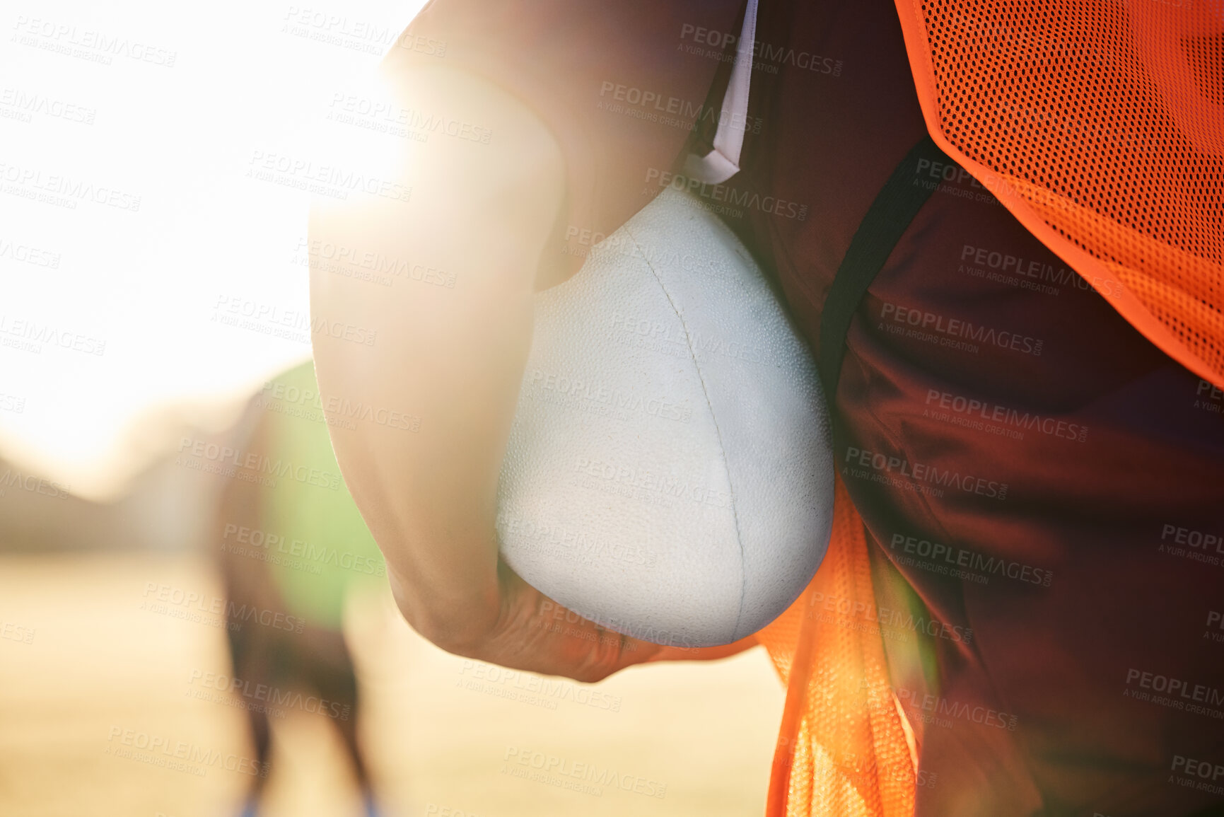 Buy stock photo Rugby, sports and hands on ball in exercise, workout or training outdoor at field lens flare. American football, fitness and man ready to start practice in game, competition or match for body health