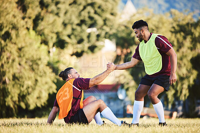 Buy stock photo Rugby, teamwork and a sports man helping a friend while training together on a stadium field for fitness. Partnership, exercise and team building with an athlete and teammate outdoor for support