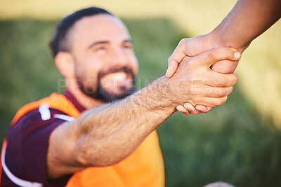 Buy stock photo Hands, rugby and teamwork with a man helping a friend while training together on a stadium field for fitness. Sports, exercise and team building with an athlete and teammate outdoor for support