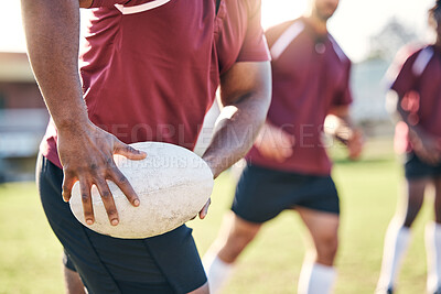 Buy stock photo Hands, rugby and ball with a team on a field together for a game or match in preparation of a competition. Fitness, sports and teamwork with a group of men outdoor on grass for club training
