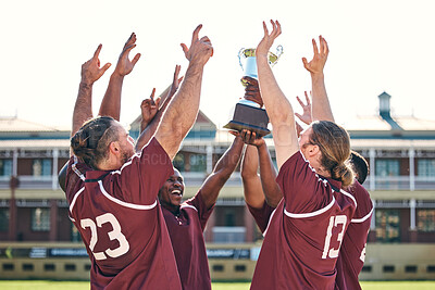 Buy stock photo Rugby, team and winner with trophy, champion and men at stadium with success, celebration and achievement. Male people outdoor, exercise and win competition, solidarity and cheers with sports game