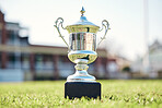 Trophy on grass, champion and award with fitness outdoor, competition and game with mockup space. Prize on pitch, reward and tournament cup with goals, stadium and sports ground field with winner 