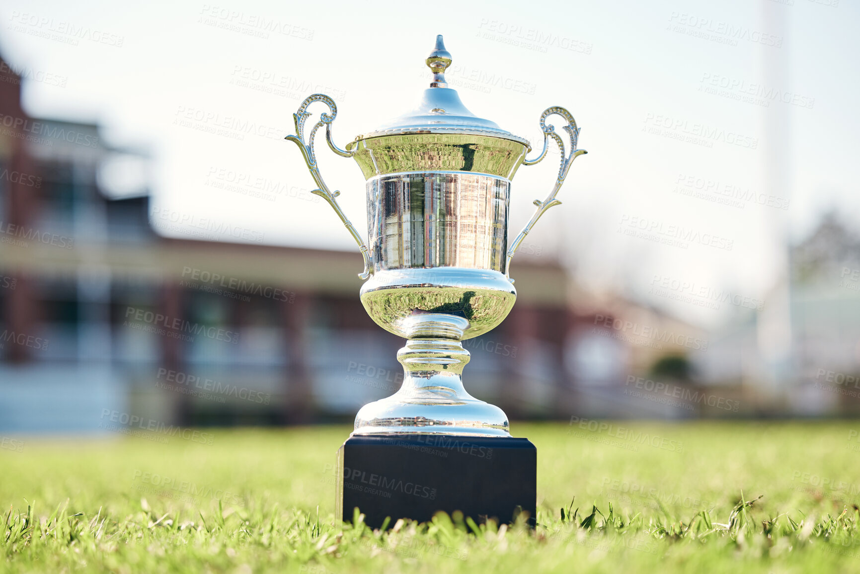 Buy stock photo Trophy on grass, champion and award with fitness outdoor, competition and game with mockup space. Prize on pitch, reward and tournament cup with goals, stadium and sports ground field with winner 