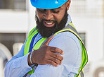 Black man, engineer or hand on shoulder pain, injury accident or muscle tension on rooftop. Hurt, stress or injured male contractor with sore arm, ache and joint inflammation at construction site