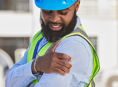 Buy stock photo Black man, engineer or hand on shoulder pain, injury accident or muscle tension on rooftop. Hurt, stress or injured male contractor with sore arm, ache and joint inflammation at construction site
