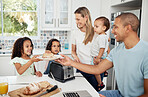 Mom, dad and kids with toast, breakfast and happy in kitchen with interracial love, bonding and care. Parents, young children and bread for family, father or work from home in morning with big family