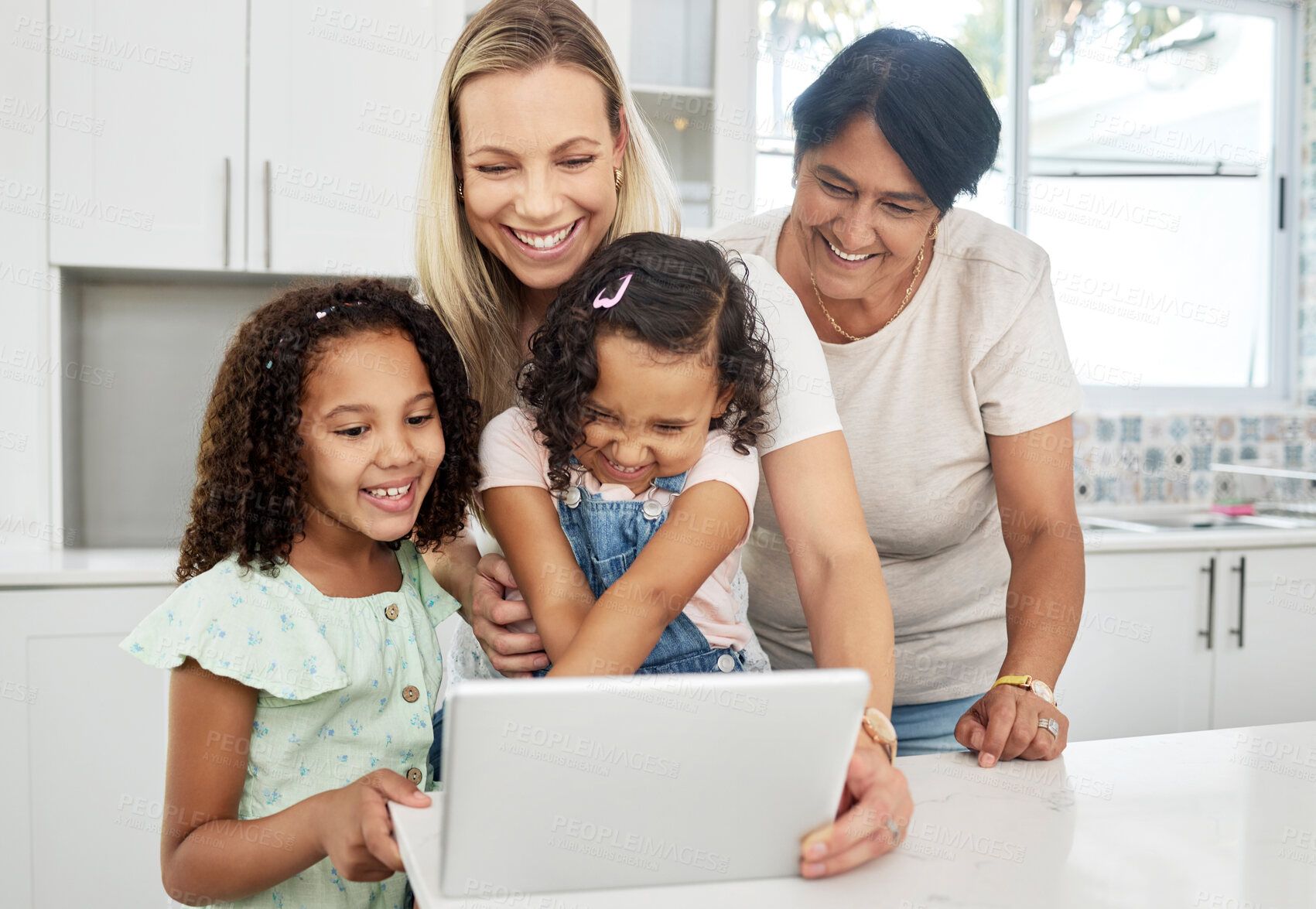 Buy stock photo Blended family, adoption and a girl with her mother on a tablet in the kitchen for education or learning. Children, diversity or study with a parent and granny teaching girl kids at home together