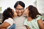 Kids kissing their grandmother on the cheek with care, love and happiness while relaxing in the living room. Smile, happy and senior woman hugging girl children for bonding together at family home.