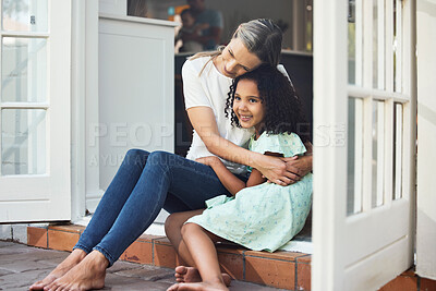 Buy stock photo Adoption, mom and child together for hug, support or love in family home of girl in foster care with a smile of happiness. Interracial, mother and daughter bonding in embrace or playing outdoor