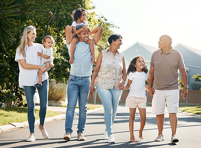 Buy stock photo Happy, big family and walking outdoor in neighbourhood street together for fun, bonding or activity with kids, parents and grandparents. Summer, vacation or grandchildren on holiday or adventure