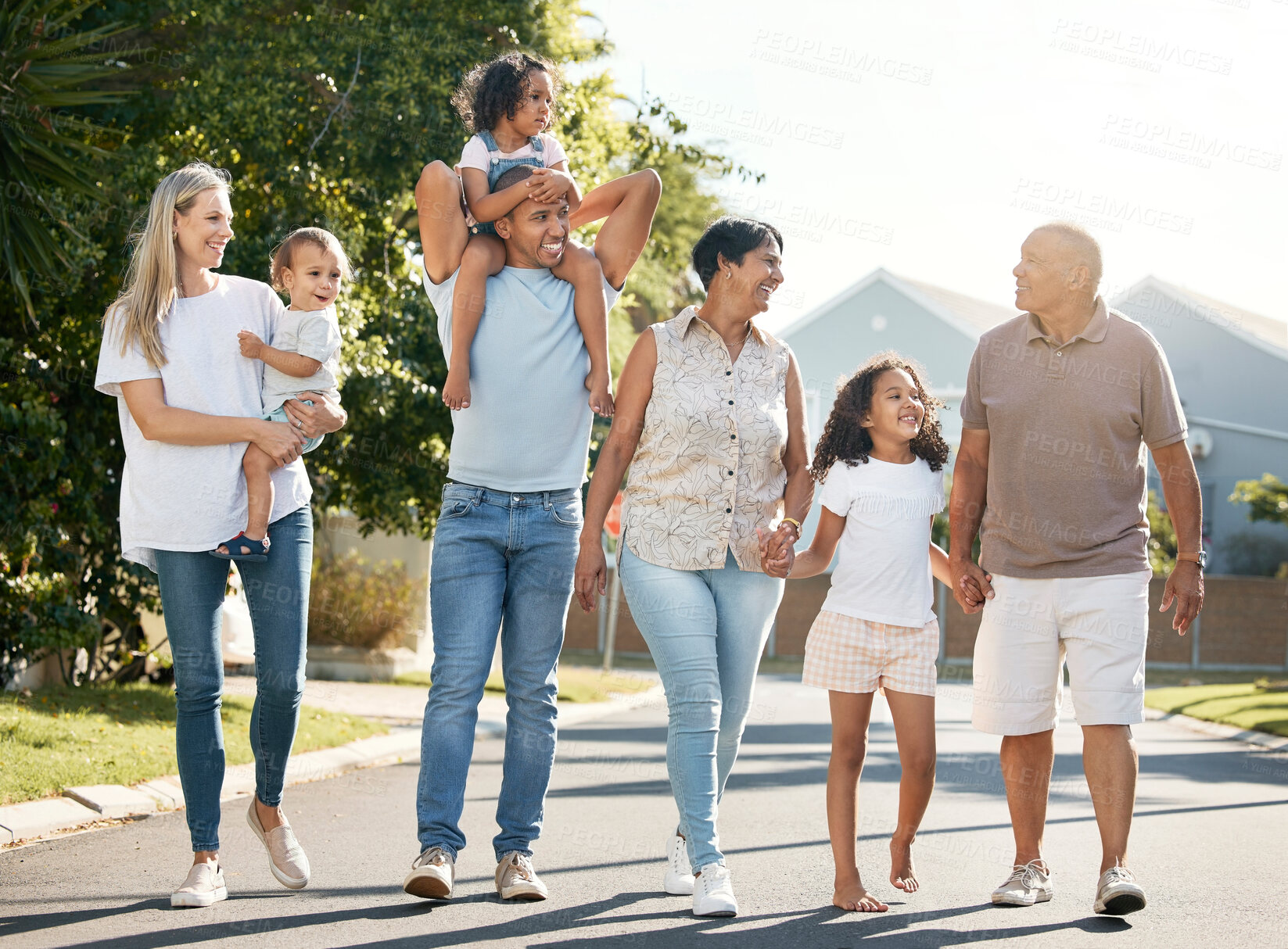 Buy stock photo Happy, big family and walking outdoor in neighbourhood street together for fun, bonding or activity with kids, parents and grandparents. Summer, vacation or grandchildren on holiday or adventure