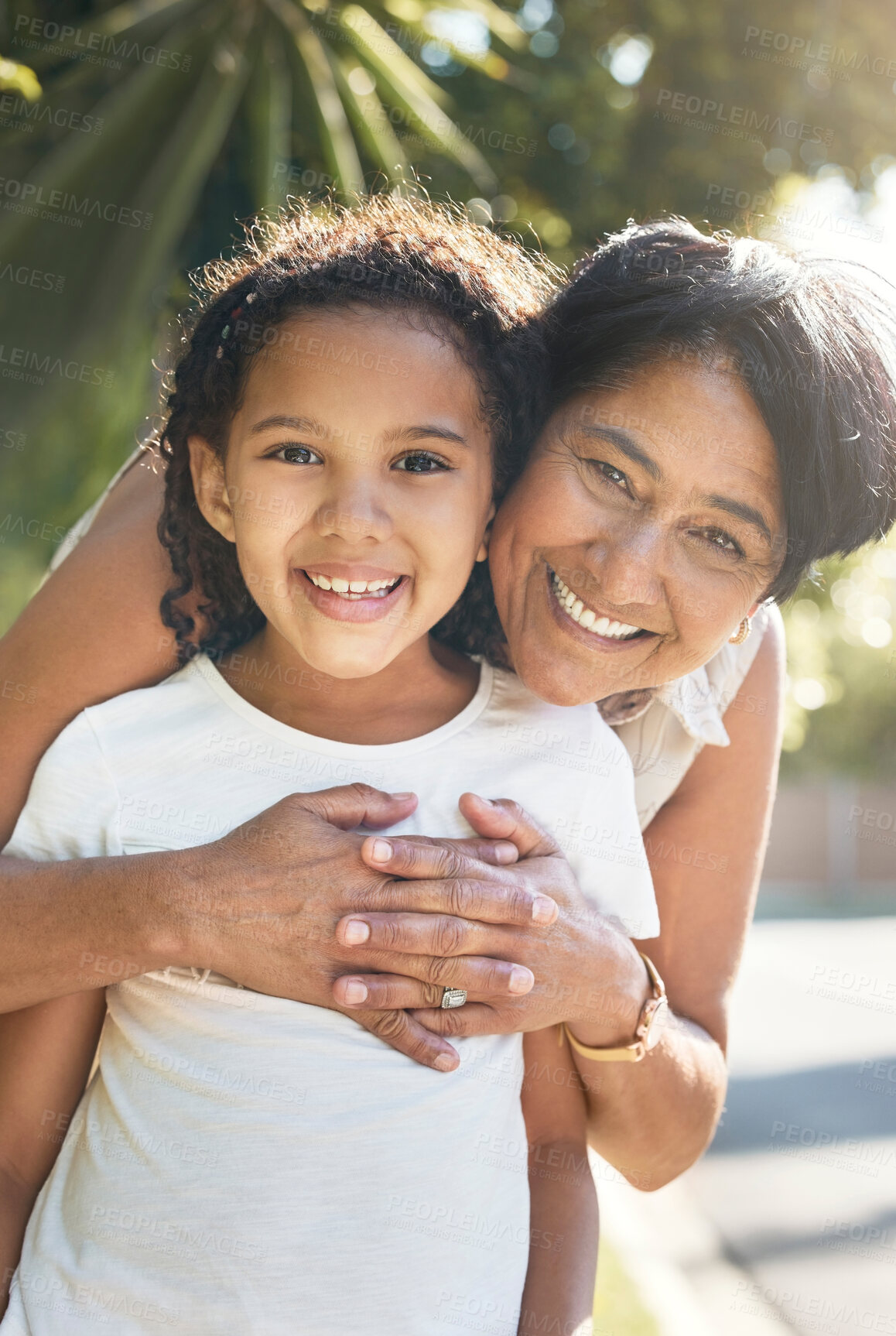 Buy stock photo Portrait, kid or happy grandmother hug outdoor for bonding with love, support or care in retirement. Face, girl child or mature grandma with smile, peace or trust on family holiday vacation to relax