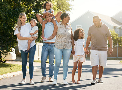 Buy stock photo Big family, outdoor and walking in neighbourhood together for fun, bonding or activity with kids, parents and grandparents. Summer, time and happy people relax with children on vacation or holiday