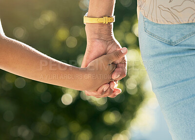 Buy stock photo Holding hands, mother and daughter in closeup, outdoor and walking together with care, love or bonding, Mom, young kid and summer sunshine in garden, backyard or park for family, vacation and freedom