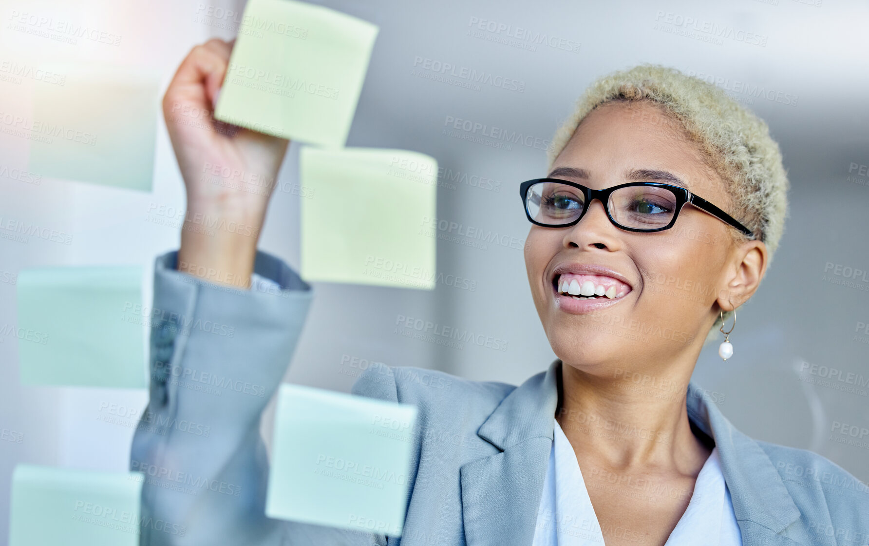 Buy stock photo Writing, planning and happy business woman in office with sticky note goal, idea or strategy. Schedule, smile and happy female manager brainstorming calendar, mission or agenda, management or growth