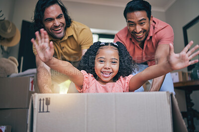 Buy stock photo Family home, girl and box with dad, push and gay parents with games, portrait and excited on floor with moving. LGBTQ men, female child and cardboard package for car, airplane and speed in new house