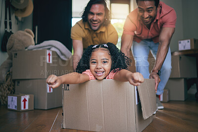 Buy stock photo Family home, girl and box with father, push and gay parents with games, portrait and excited on floor with moving. LGBTQ men, female kid and cardboard package for car, airplane and speed in new house