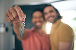 Hand holding, keys and gay couple smile for real estate, success or new home celebration. Property, dream or lgbt men embrace with love, smile or excited for moving, apartment or mortgage loan