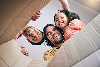 Buy stock photo Family, open box and moving from below, portrait and smile in new house with gay father, girl kid and excited. LGBTQ men, cardboard package and happy with female child for start, life and property