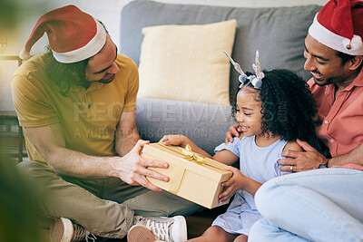 Buy stock photo Gay, Christmas and a father with a gift for a child, celebration and holiday as a family. Smile, home and an lgbt man with a festive present for a girl kid in the living room of a house together