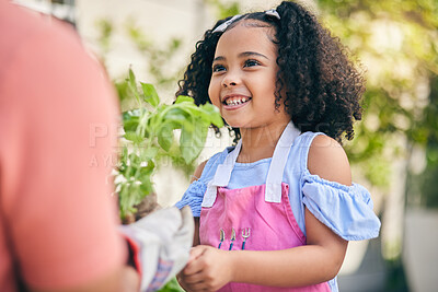 Buy stock photo Gardening, parent and girl child with plants in backyard, teaching and learning with growth in nature. Smile, sustainability and person helping daughter in vegetable garden with love, support and fun
