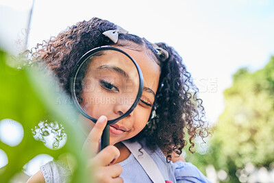 Buy stock photo Girl child, magnifying glass and leaves in garden, backyard or park in science, study or outdoor. Young female kid, lens and zoom for nature, research or check for plant, ecology or growth in summer