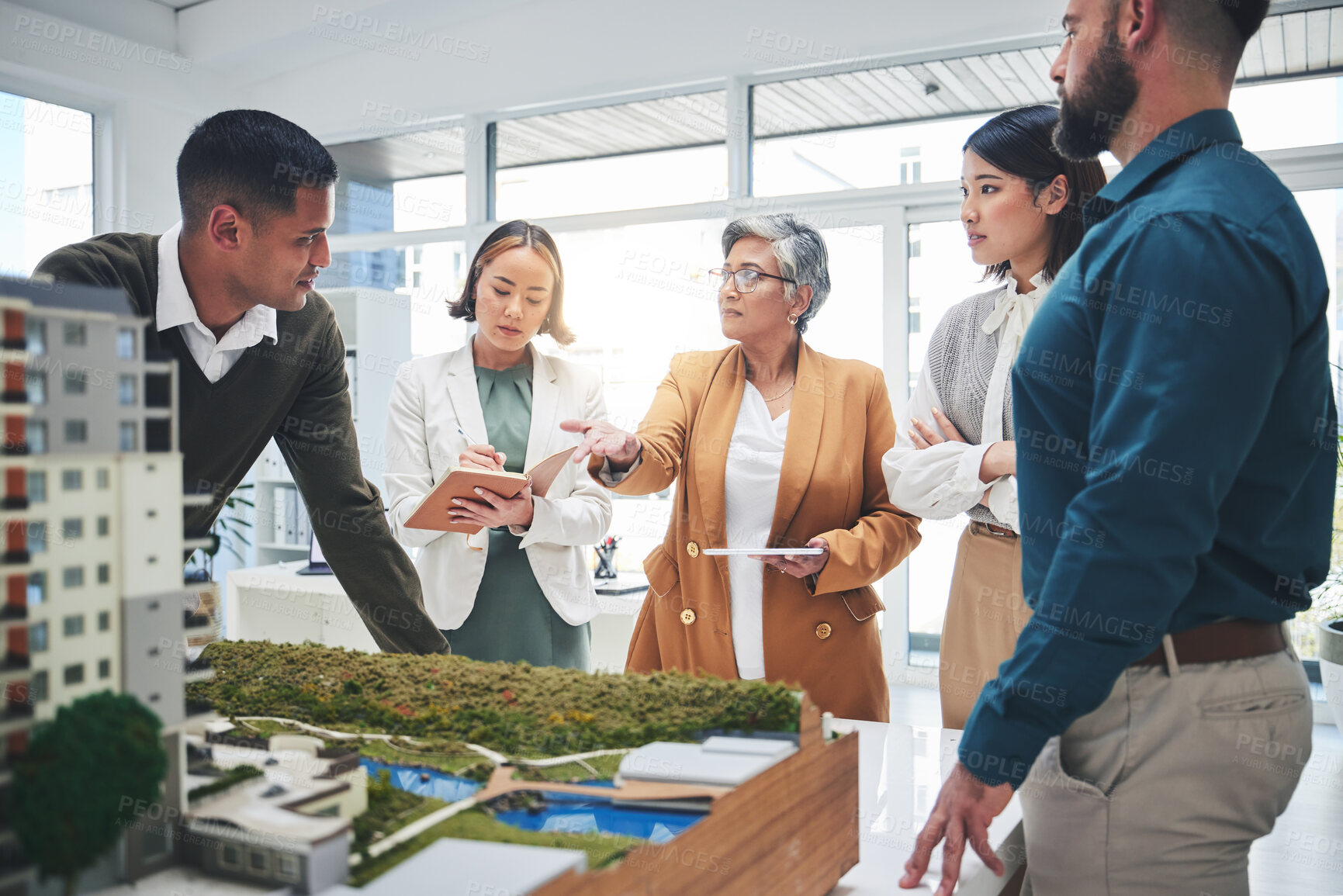 Buy stock photo Creative people, real estate and meeting with 3D model, building project or team startup at office. Group in teamwork discussion for architecture, brainstorming or planning strategy at the workplace