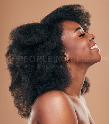 Buy stock photo Beauty, hair and profile with a natural black woman in studio on a brown background for organic cosmetics. Face, smile and haircare with a happy young afro female person indoor for shampoo treatment