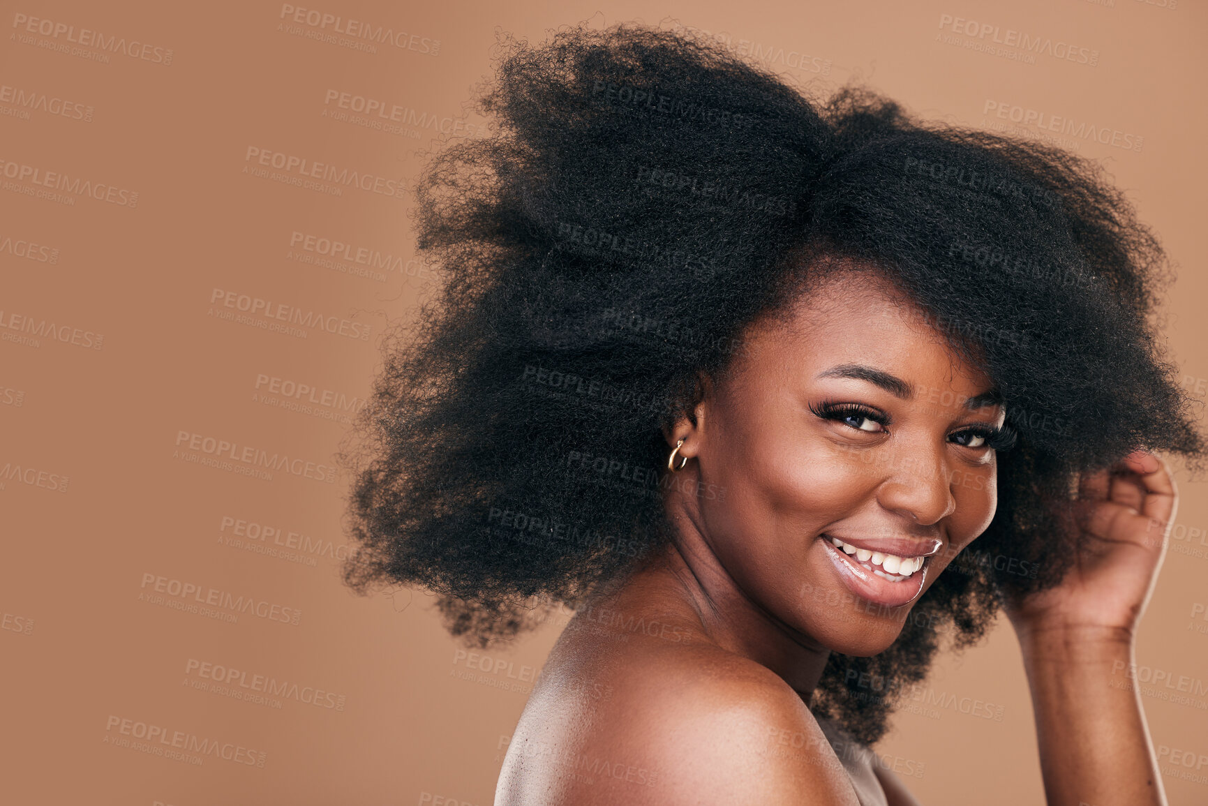 Buy stock photo Portrait, hair care and black woman with smile, beauty and wellness on a brown studio background. Mockup space, person and model with texture, afro and natural with aesthetic, makeup and cosmetics