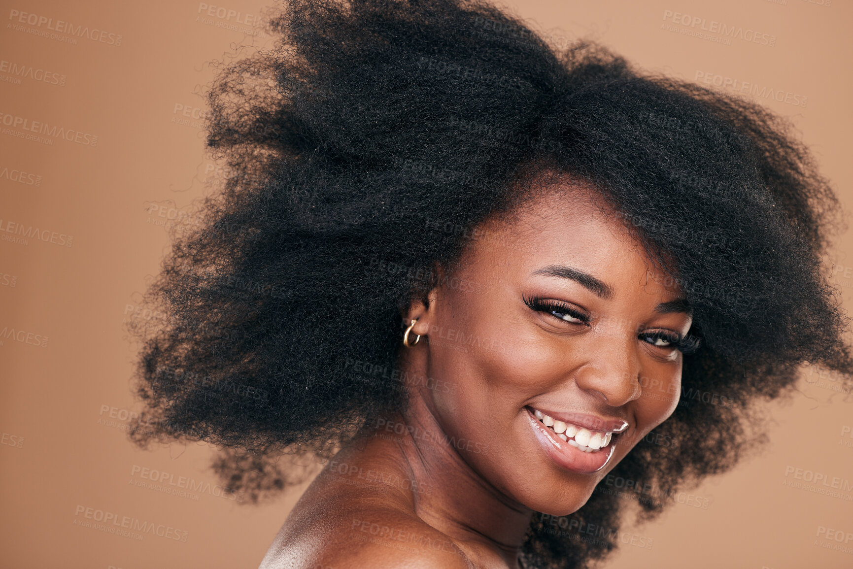 Buy stock photo Portrait, hair care and black woman with beauty, afro and smile on a brown studio background. Cosmetics, person and African model with texture, shine and volume with aesthetic, wellness and glow