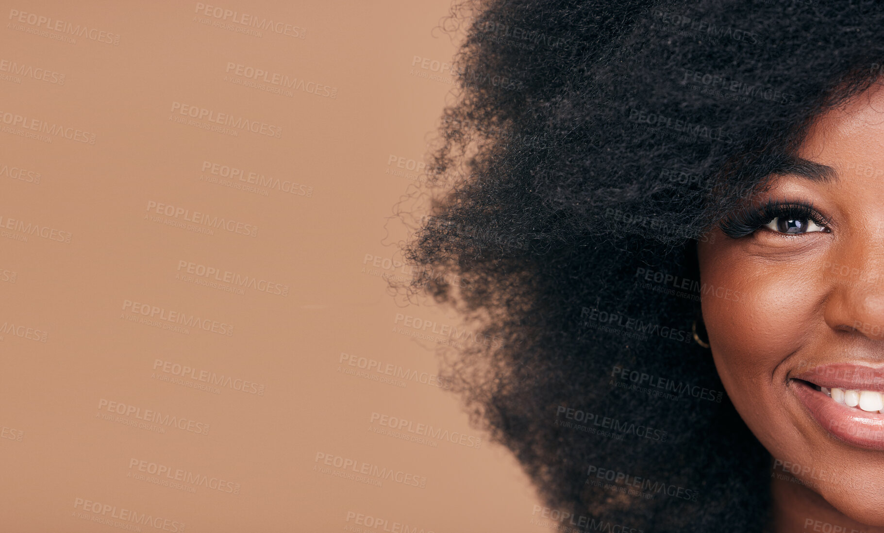 Buy stock photo Portrait, hair and mockup with a model black woman in studio on a brown background for natural cosmetics. Half face, smile and haircare with a happy afro female person on space for shampoo treatment