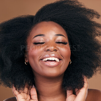 Buy stock photo Beauty, black woman and hair care for afro, smile or volume on a brown studio background. Growth, hairstyle or African model with cosmetics after salon treatment, wellness or funny with natural shine