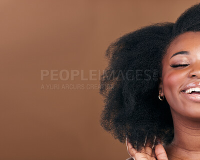 Buy stock photo Mockup, closeup and black woman with hair care, smile or cosmetics on a brown studio background. Half, African model or person with aesthetic, salon treatment for afro or wellness with natural beauty