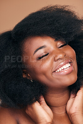 Buy stock photo Smile, black woman and hair care for afro, beauty and cosmetics on a brown studio background. Growth, hairstyle or African model with makeup after natural treatment, texture or shine with wellness